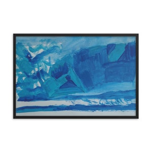 May include: Abstract art print in a black frame. The artwork features a dynamic composition of blue and turquoise brushstrokes, creating a sense of movement and depth. The painting evokes a landscape or seascape with its layered hues.