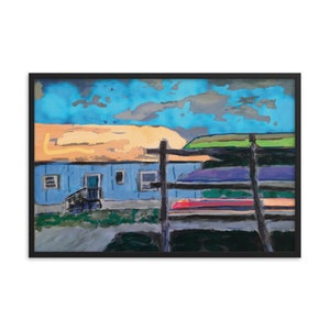 May include: Framed art print of a colorful landscape. The artwork depicts a blue building with a brown roof under a vibrant sky. A wooden fence is in the foreground. The painting uses bold brushstrokes and a vivid color palette.