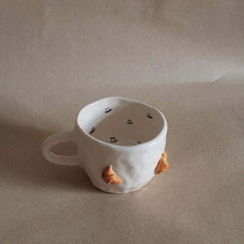 Handmade Ceramic Croissant Mug: Smiley Face Pottery Coffee Cup