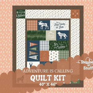 May include: A quilt kit featuring a woodland theme with a brown, green, blue, and white color scheme. The kit includes fabric for a 40" x 46" quilt and the text "Adventure is Calling Quilt Kit".