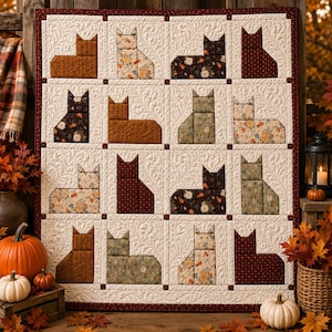 May include: A square quilt featuring a grid of sixteen blocks, each displaying a cat silhouette in various floral and solid fabrics. The background of each block is cream-colored with a swirling feather quilting pattern, framed by a dark red border.