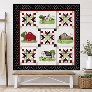 May include: A square quilt featuring a central grid of nine blocks. Four blocks display farm scenes with barns, silos, and cows on green grass. Five blocks feature a geometric star pattern in red, white, black, and light green, framed by a black border.