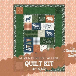 May include: A green and brown quilt kit with a camping theme. The kit includes a variety of fabrics with different patterns and designs, including a wolf, a bear, a deer, and a tree. The kit is 41 inches by 53 inches.
