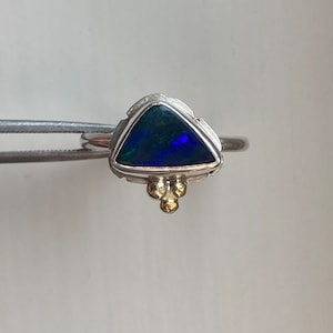 Boulder opal, sterling silver and 14 karat gold details. Green blue flashes, triangle shaped, solid Winton opal. Unique, artisan ring