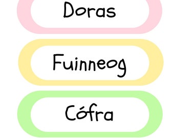 May include: Four colorful labels with rounded edges and white text in black. The labels read "Bata gliú", "Doras", "Fuinneog", and "Cófra".