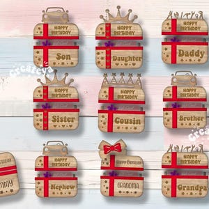 May include: Set of 10 wooden gift box ornaments with different designs and names, including "Son", "Daughter", "Daddy", "Sister", "Cousin", "Brother", "Mommy", "Nephew", "Grandma", and "Grandpa". Each ornament features a red ribbon, a gift box, and the word "Happy Birthday".