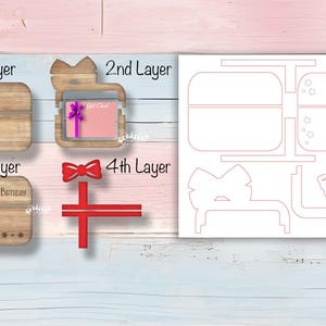 May include: A four-layer, laser-cut, wooden box with a gift card slot. The box is decorated with a bow, stars, and the words "Happy Birthday".