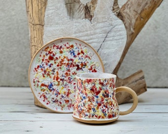 Juego de taza y plato de desayuno con motivo de flores silvestres