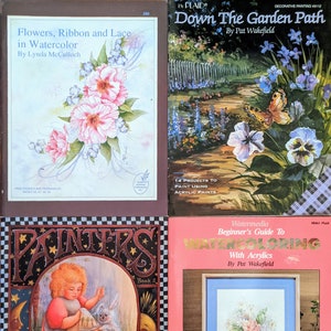 May include: Four watercolor painting books with colorful covers. The covers feature flowers, a garden path, a girl painting, and a vase of flowers.