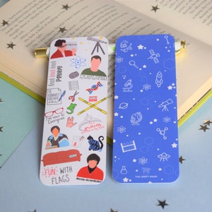 May include: Two rectangular bookmarks. One is white with colourful cartoon images and text, including "Knock Knock Knock Penny" and "Fun with Flags." The other is blue with white science-themed icons. A gold bookmark is in an open book.