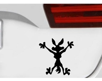 May include: Black silhouette of a coyote cartoon character with arms raised in the air, standing on two legs. The coyote is in a running pose with its mouth open and tongue sticking out. The silhouette is on a white background.