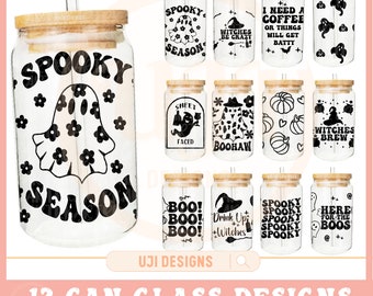 May include: A set of 12 clear glass can designs with bamboo lids and straws, ideal for Halloween. Each glass features a unique black and white spooky design, including ghosts, pumpkins, and phrases like "Spooky Season" and "Witches Brew."