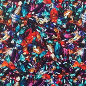 May include: A vibrant, jewel-toned pattern featuring an array of colorful gemstones. The design showcases a variety of shapes and sizes, with prominent colors including red, blue, orange, purple, and green. The gemstones are set against a dark background.