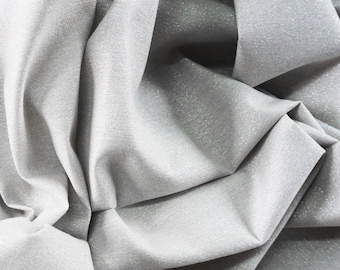 Cloud 9 fabrics Glimmer Solids in silver 85 / 15 % Cotton / Metallic respectively. Sparkly fabric