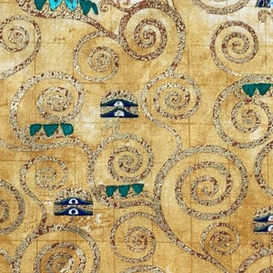 May include: A beige fabric with a repeating pattern of gold swirls and blue and green accents. The fabric has a subtle grid pattern.
