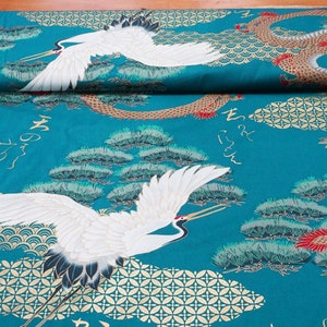 May include: Teal fabric featuring a white crane and a gold dragon design. The fabric also includes gold pine trees and Japanese characters.