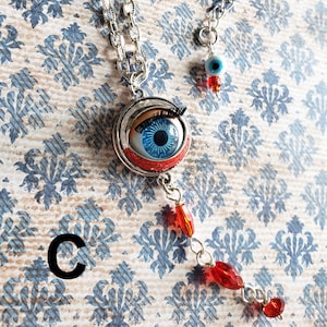 Bloody Baby Doll Eyeball Necklace: Creepy Jewelry (Age 16+)