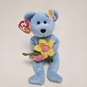 Ty Beanie Baby “Bluebonnet” the Blue Bear Holding Flowers (8.5 inch)