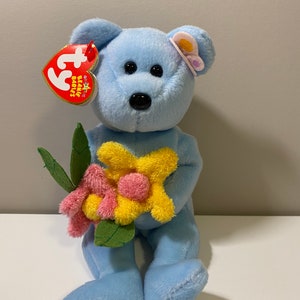 Ty Beanie Baby “Bluebonnet” the Blue Bear Holding Flowers (8.5 inch)