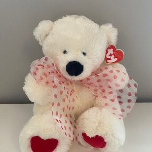 Ty Classics Collection “Caressa” the Bear  with Hearts on Feet and  Ribbon Bow around Neck (11 inch)