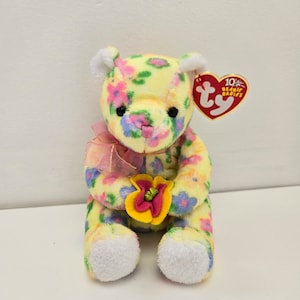 Ty Beanie Baby “Bloom” the Bear holding flowers (6 inch)