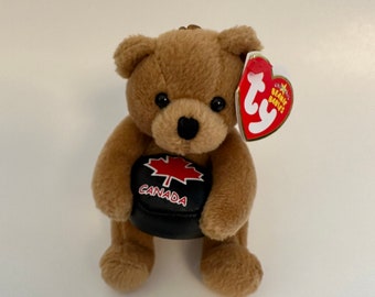 Ty Clip / Schlüsselanhänger “Deke” der Bär mit Puck - Schlüsselanhänger aus Metall (10,5 cm)