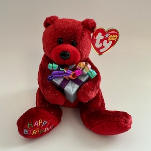 Ty Beanie Baby “Feliz Aniversário”, o Urso Vermelho Segurando um Presente (7,5 polegadas)