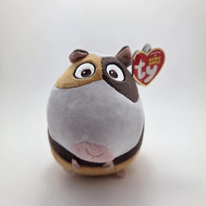 Peluche Beanie Baby &quot;Norman&quot;, el conejillo de indias, con etiqueta arrugada - La vida secreta de tus mascotas (12,7 cm)