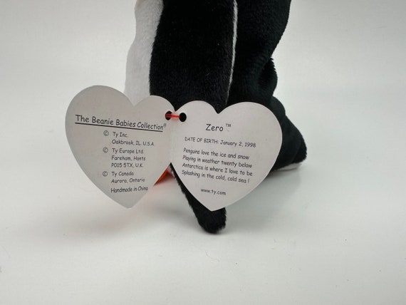 Ty Beanie Baby “zero” the Christmas Penguin Wearing a Santa Hat