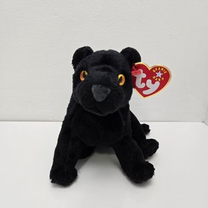 May include: Black plush beanie baby toy panther with a red and white Ty tag that says "Beanie Baby".