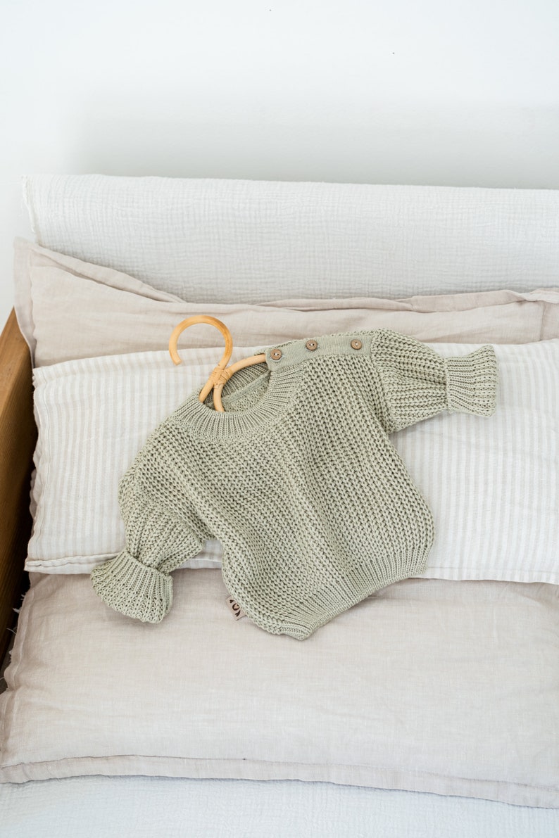 Newborn coming home outfit - baby knit sweater with buttons on the shoulder. Pregnancy Gift Idea