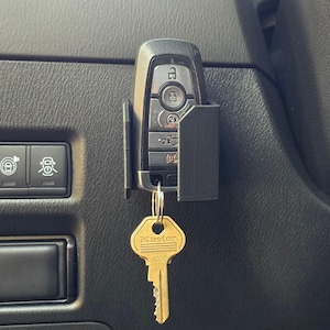 May include: A set of three ceramic mugs with a speckled, matte finish. The mugs are in shades of cream, light gray, and dark gray. Each mug has a simple, minimalist design, perfect for coffee or tea.