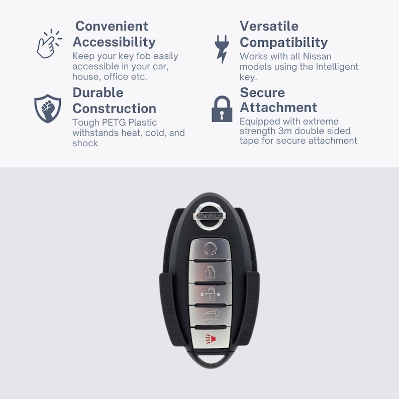 May include: A black key fob holder with a silver Nissan logo and five buttons. The holder is designed to securely attach to a car's interior using 3M double-sided tape.