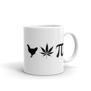 May include: White ceramic mug with a black chicken silhouette, cannabis leaf, and the Greek letter pi. The mug has a curved handle and is set against a white background. A fun and quirky design.