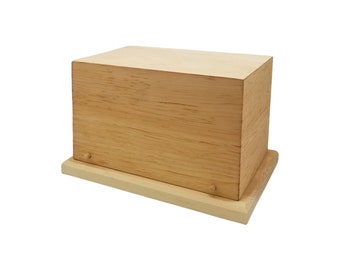 May include: A wooden box with a lid, made of light brown wood. The box has a simple design and is perfect for storing small items.