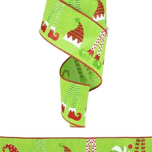 May include: Green and red ribbon with a repeating pattern of elf legs and hats. The ribbon has a glittery finish.
