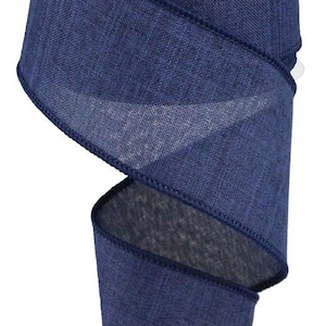 May include: A roll of navy blue burlap ribbon with a wired edge. The ribbon is textured and has a subtle sheen.