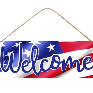 May include: A wooden welcome sign with a red, white, and blue American flag design. The word "Welcome" is written in blue cursive letters.