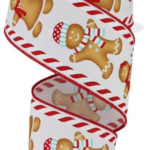 May include: White ribbon with a red and white candy cane stripe border. The ribbon is decorated with gingerbread people wearing scarves and hats.