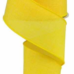 May include: A roll of bright yellow wired ribbon with a textured, linen-like finish. The ribbon is 2.5 inches wide and is perfect for crafting and decorating.