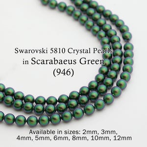 May include: Strands of Swarovski 5810 Crystal Pearls in Scarabaeus Green. The beads have an iridescent finish. Available in sizes from 2mm to 12mm. The image shows multiple strands of the beads, showcasing their colour and shape.