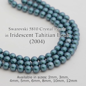 May include: Strands of iridescent blue-green Swarovski 5810 Crystal Pearls. The pearls have a Tahitian look. Available in sizes from 2mm to 12mm. The image includes the text "Swarovski 5810 Crystal Pearls in Iridescent Tahitian Look (2004)".