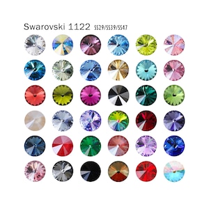 May include: Assortment of 36 Swarovski 1122 crystal rhinestones in various colors, including clear, blue, green, red, and purple. The rhinestones are arranged in a grid pattern.