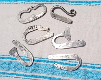 Assorted Hand Forged Steel Strikers; fish, whale, horse, dog, and traditional styles.