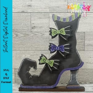 May include: A black wooden witch shoe with green, purple, and white accents. The shoe has three decorative bows and a high heel. The text "Instant Digital Download" and "SVG & DXF Format" are visible on the left side of the image.
