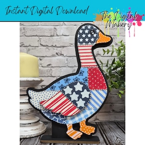 May include: A wooden duck decoration with a patchwork design in red, white, and blue, featuring stars and stripes. The duck has an orange beak and feet, and is standing on a black base. Text on the image reads "Instant Digital Download" and "The Digital Makery".