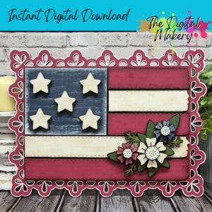 May include: A patriotic wooden American flag design with a decorative border. The flag features red and white stripes, a blue field with five stars, and floral accents. The text "Instant Digital Download" and "The Digital Makery" are visible.