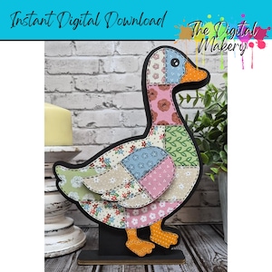 May include: A wooden duck decoration with a patchwork design. The duck features various floral and patterned fabrics in shades of pink, blue, green, and beige. It has an orange beak and feet, and is mounted on a black base. The text "Instant Digital Download" and "The Digital Makery" are visible.