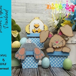 May include: Three Easter-themed wooden planter boxes with a chick, bunny, and a gray bunny. The chick planter is yellow with black eyes and a beak. The bunny planter is brown with pink ears and a white nose. The gray bunny planter is gray with white feet. All three planters have blue and white polka dot designs.