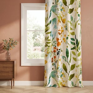 May include: A floor-length curtain featuring a watercolor-style botanical print with green leaves, yellow berries, and soft blue accents on an off-white background. The fabric hangs in vertical folds, displaying a repeating pattern of foliage.